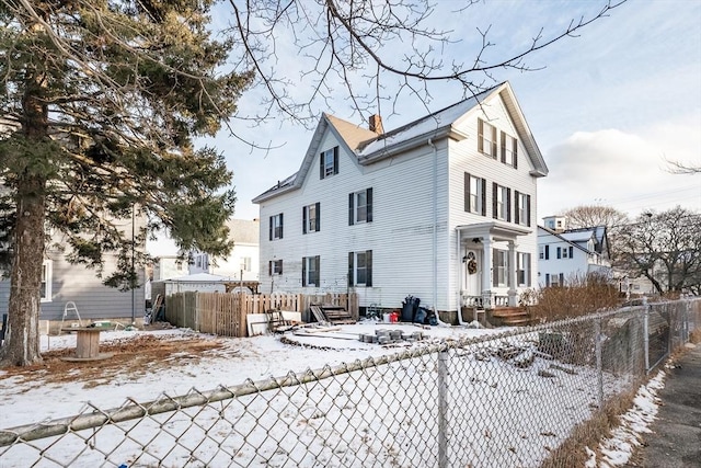 view of snow covered house