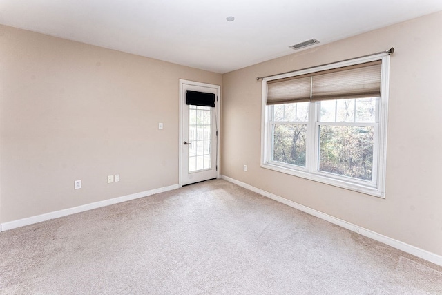 empty room with light colored carpet