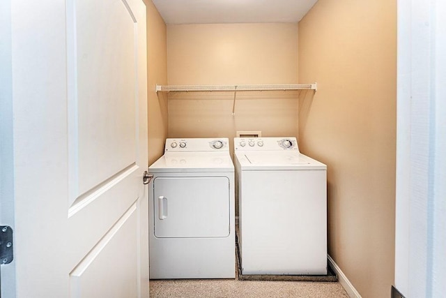 washroom with washing machine and dryer