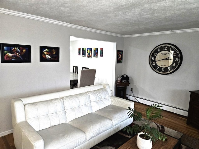 living room featuring baseboard heating, wood finished floors, ornamental molding, and a textured ceiling