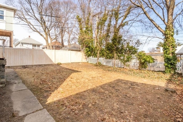 view of yard with a fenced backyard