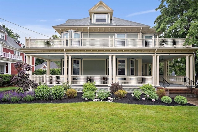 9 Arlington Rd, Woburn, MA 01801 - back of house featuring a balcony, covered porch, and a lawn