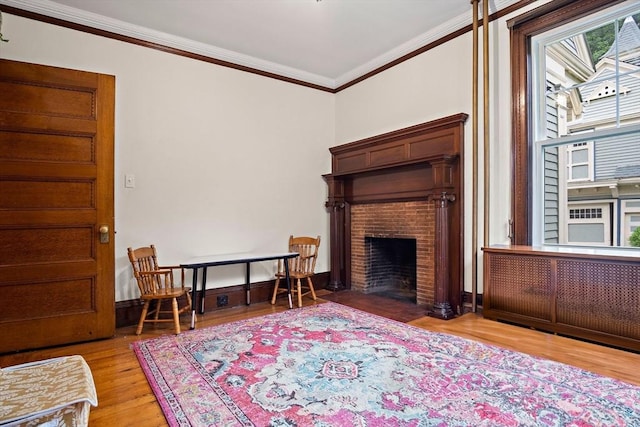 9 Arlington Rd, Woburn, MA 01801 - living room with ornamental molding, wood finished floors, and a brick fireplace