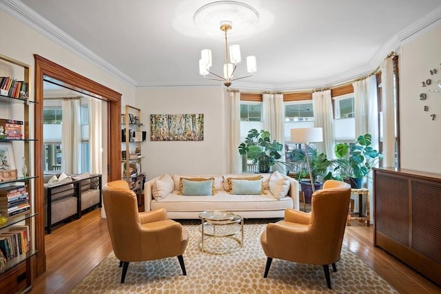 9 Arlington Rd, Woburn, MA 01801 - living area with wood finished floors, ornamental molding, and a chandelier