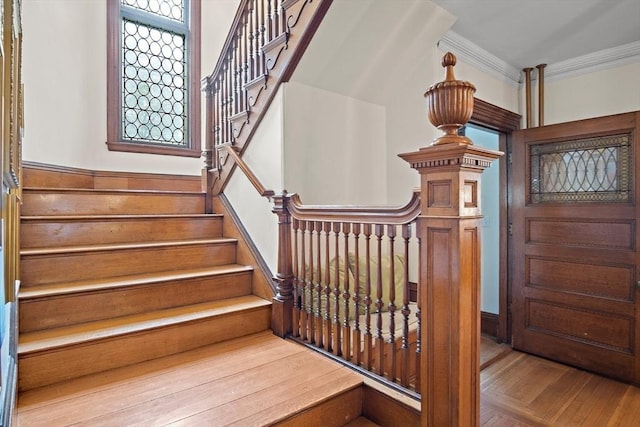 9 Arlington Rd, Woburn, MA 01801 - stairway with crown molding and wood finished floors