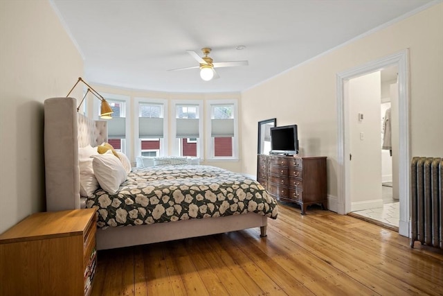 9 Arlington Rd, Woburn, MA 01801 - bedroom featuring ornamental molding, radiator, hardwood / wood-style flooring, and ceiling fan