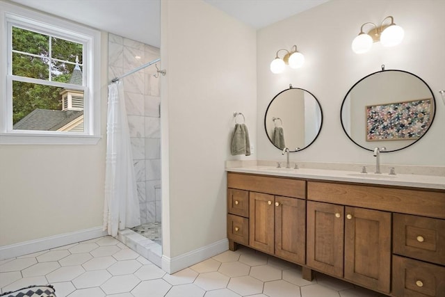 9 Arlington Rd, Woburn, MA 01801 - bathroom featuring double vanity, a stall shower, and tile patterned flooring