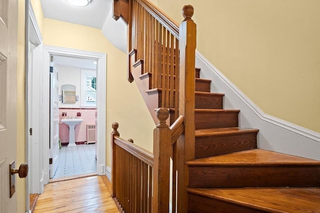 9 Arlington Rd, Woburn, MA 01801 - staircase with radiator heating unit and wood-type flooring