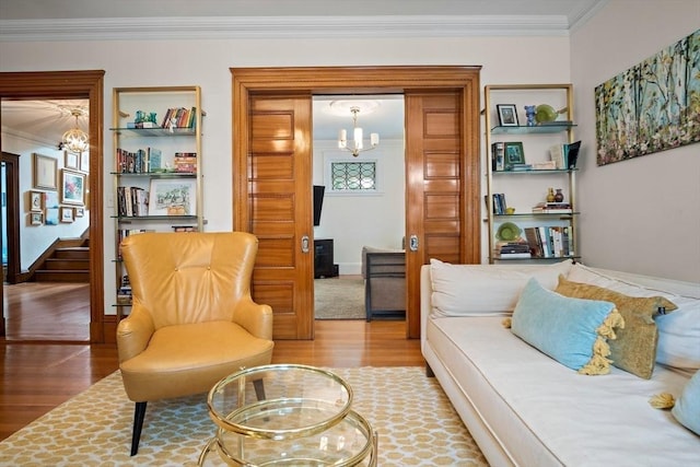 9 Arlington Rd, Woburn, MA 01801 - living room with a chandelier, wood finished floors, crown molding, and stairs