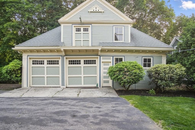 9 Arlington Rd, Woburn, MA 01801 - view of front of house with a garage and a shingled roof
