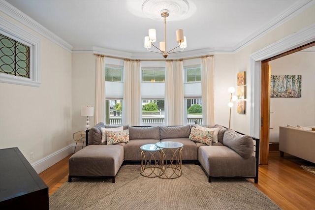 9 Arlington Rd, Woburn, MA 01801 - living room with a chandelier, light wood-type flooring, and crown molding