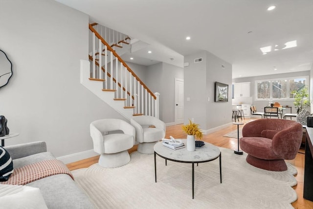 123-125 Centre St Unit Th4, Boston, MA 02124 - living area with light wood-type flooring, recessed lighting, baseboards, and stairs