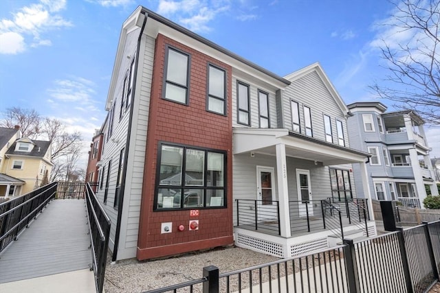 123-125 Centre St Unit Th4, Boston, MA 02124 - view of front of home with a porch and fence private yard