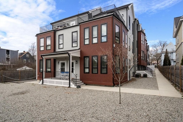 123-125 Centre St Unit Th4, Boston, MA 02124 - multi unit property with central air condition unit, fence, and covered porch