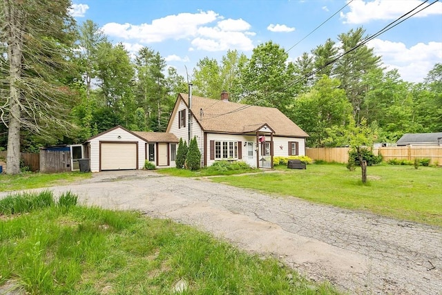 10 Worcester Rd, Townsend, MA 01469 - view of front facade with asphalt driveway, an attached garage, and a chimney