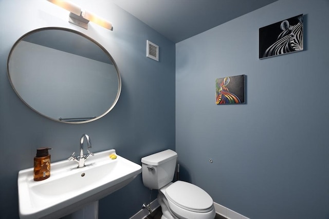 bathroom with toilet and sink