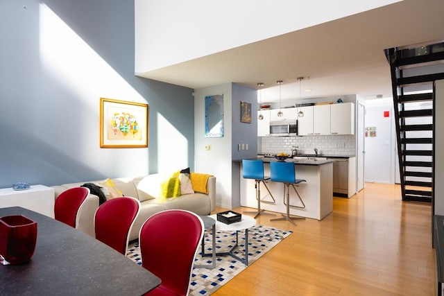 living room with light hardwood / wood-style flooring