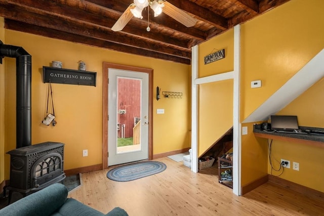 19 E St, Grafton, MA 01536 - entrance foyer featuring a wooden ceiling with exposed beams, wood finished floors, a ceiling fan, and a wood stove