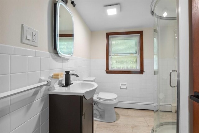 268 Pine St, Tewksbury, MA 01876 - bathroom featuring tile walls, vanity, wainscoting, a stall shower, and a baseboard radiator