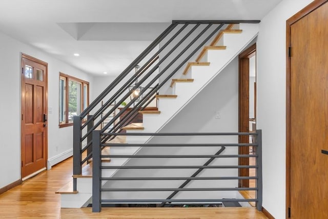 268 Pine St, Tewksbury, MA 01876 - stairs featuring wood finished floors, recessed lighting, and a baseboard radiator