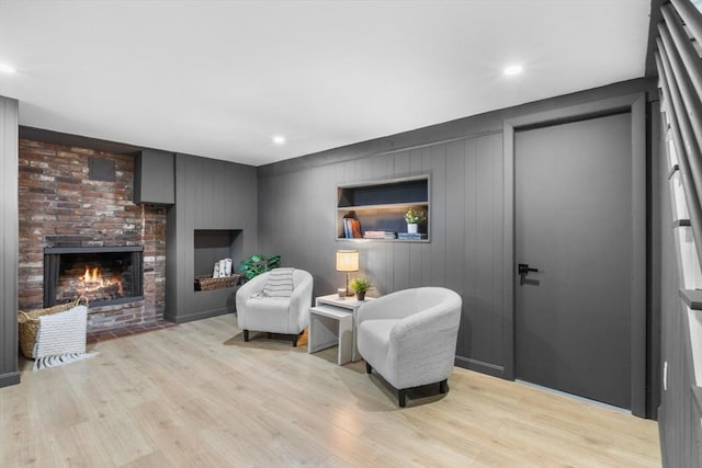 268 Pine St, Tewksbury, MA 01876 - living area with light wood finished floors, a brick fireplace, and recessed lighting
