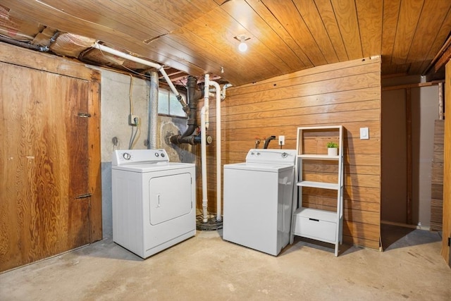 268 Pine St, Tewksbury, MA 01876 - washroom with washing machine and clothes dryer, wood ceiling, and wood walls