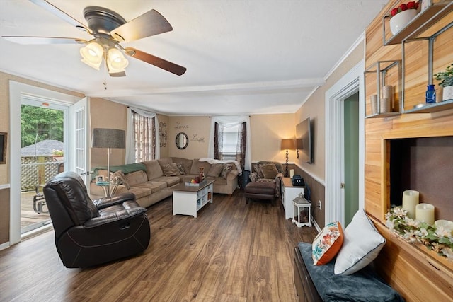 85 Everett St, Southbridge, MA 01550 - living area featuring dark wood-style flooring, a ceiling fan, and wainscoting