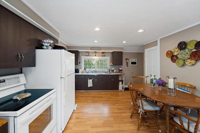 85 Everett St, Southbridge, MA 01550 - kitchen with white range with electric stovetop, dark brown cabinetry, light wood-type flooring, recessed lighting, and light countertops