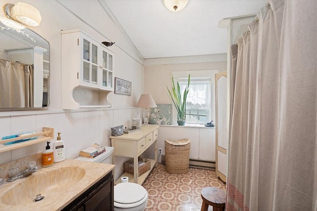 85 Everett St, Southbridge, MA 01550 - full bathroom with lofted ceiling, baseboard heating, toilet, vanity, and a shower with curtain