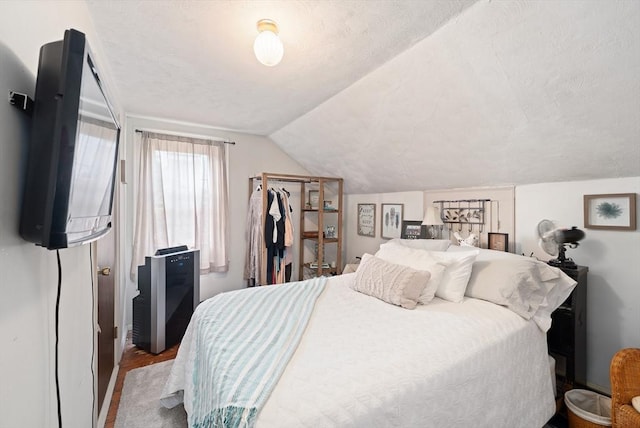 85 Everett St, Southbridge, MA 01550 - bedroom featuring lofted ceiling, wood finished floors, and a textured ceiling
