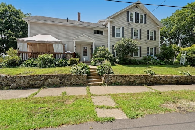 85 Everett St, Southbridge, MA 01550 - view of front of property featuring a gazebo, a front lawn, a chimney, and a deck