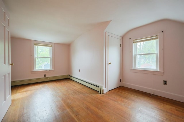 26 Presidents Rd, Weymouth, MA 02188 - unfurnished bedroom with vaulted ceiling, light wood finished floors, multiple windows, a baseboard heating unit, and baseboards