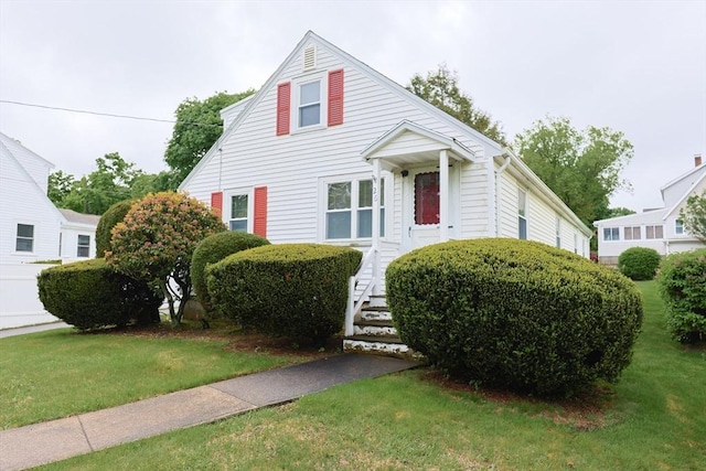 26 Presidents Rd, Weymouth, MA 02188 - view of front of home featuring a front lawn