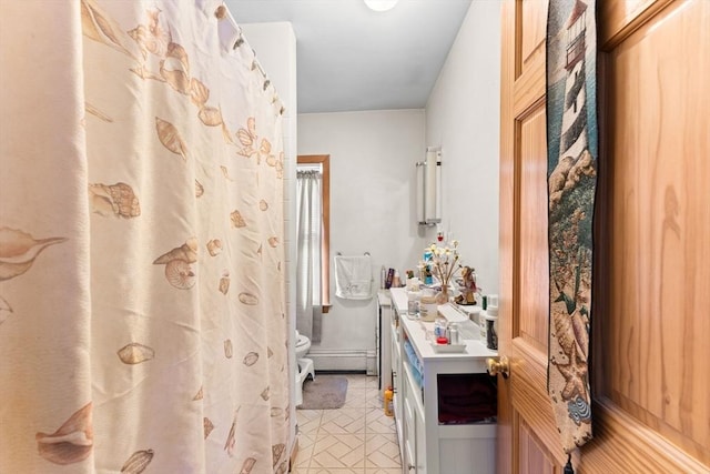 bathroom with a shower with shower curtain, a baseboard radiator, vanity, and toilet