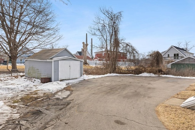 exterior space with an outbuilding and a storage shed