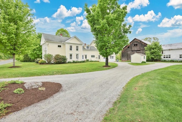 39 Cook Rd, Southampton, MA 01073 - view of front of home featuring curved driveway, a front lawn, and a chimney