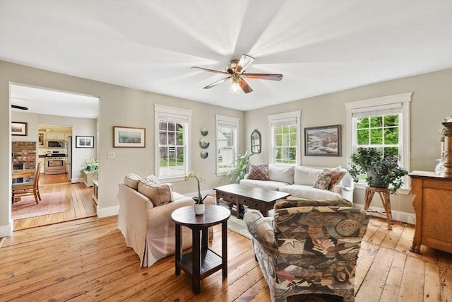 39 Cook Rd, Southampton, MA 01073 - living area with light wood-style flooring, a ceiling fan, and baseboards