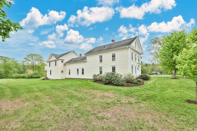 39 Cook Rd, Southampton, MA 01073 - rear view of property with a chimney and a yard
