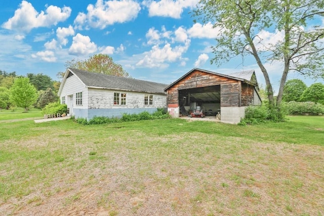 39 Cook Rd, Southampton, MA 01073 - rear view of house with a yard, an outdoor structure, and an outbuilding