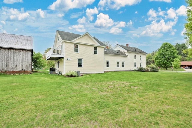 39 Cook Rd, Southampton, MA 01073 - back of property featuring a yard and a balcony