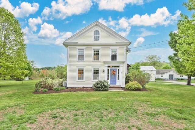 39 Cook Rd, Southampton, MA 01073 - greek revival house with a front lawn and central AC unit