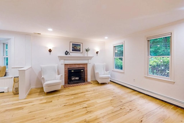 79 Charter Rd, Acton, MA 01720 - unfurnished living room with wood finished floors, a baseboard heating unit, a fireplace, crown molding, and recessed lighting