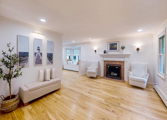 79 Charter Rd, Acton, MA 01720 - living room featuring a baseboard heating unit, a fireplace, wood finished floors, ornamental molding, and recessed lighting