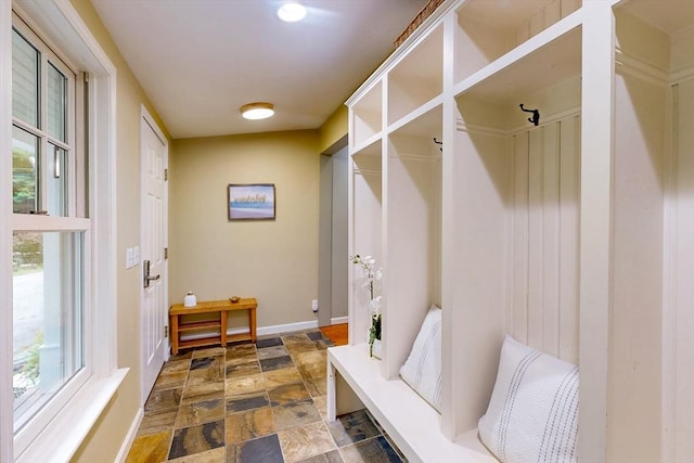 79 Charter Rd, Acton, MA 01720 - mudroom with dark stone finish floors and baseboards