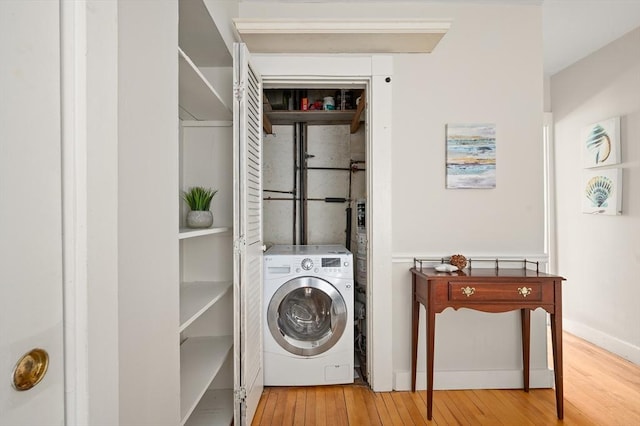 148-150 Pleasant St Unit 2, Marblehead, MA 01945 - laundry area with washer / clothes dryer and hardwood / wood-style floors