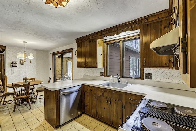 kitchen with stainless steel dishwasher, a sink, light countertops, an inviting chandelier, and under cabinet range hood