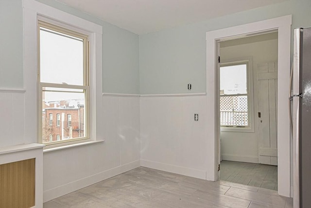 spare room with light wood-type flooring