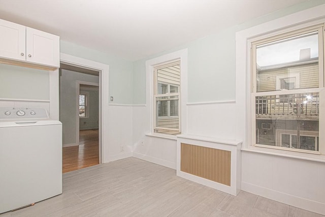 interior space featuring light hardwood / wood-style flooring and washer / dryer