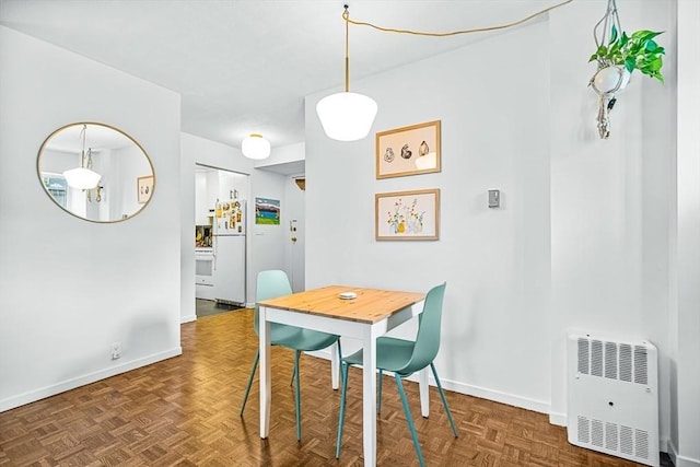19 Winchester St Unit 102, Brookline, MA 02446 - dining room featuring baseboards and heating unit