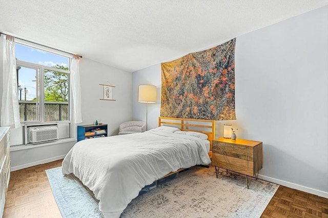 19 Winchester St Unit 102, Brookline, MA 02446 - bedroom with a textured ceiling, cooling unit, and baseboards